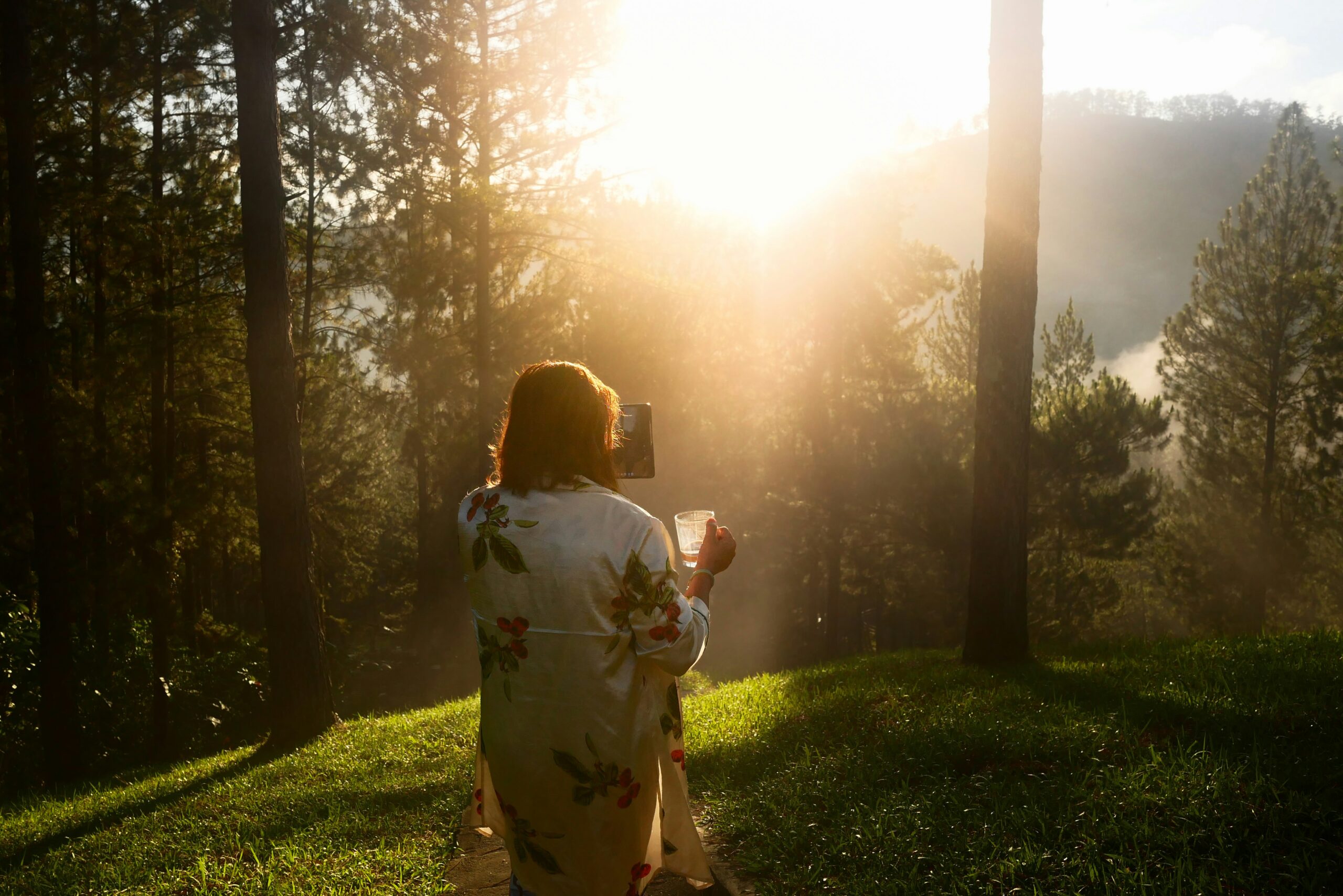 Woman in forest morning light